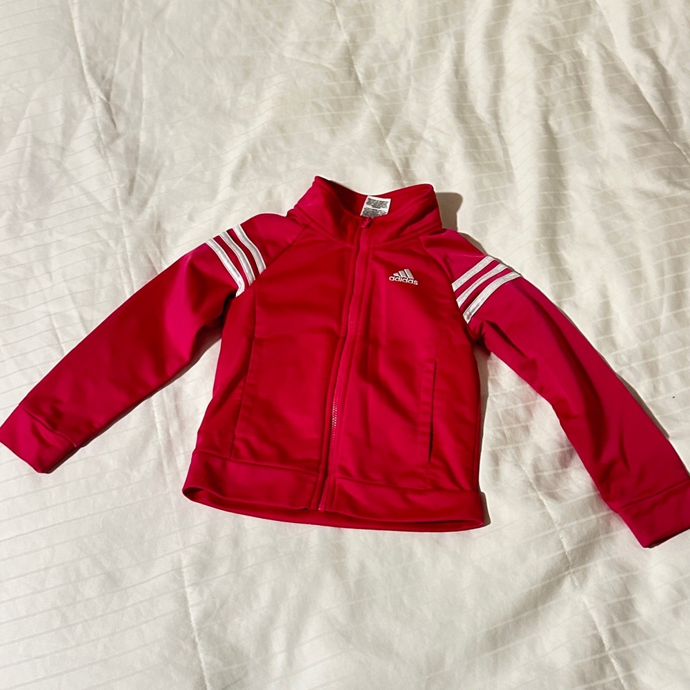 Used Pink kid Adidas set 4T have little marker line behind on the pants
